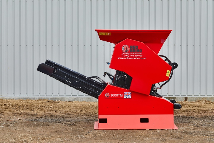 High-performance Red Rhino 3000 mini crusher in action, perfect for small to medium-scale aggregate crushing and recycling on construction sites. Efficient and robust.