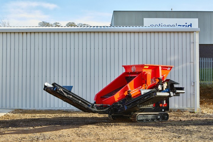 High-performance Red Rhino 3-way screener operating outdoors, ideal for efficient material sorting and separation. Boost productivity on your job site.